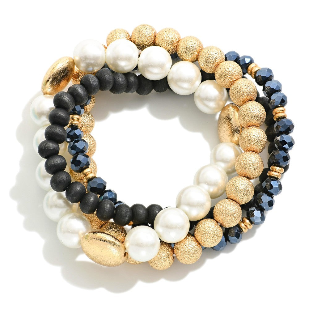 Set of Four Mixed Media Stretch Bracelets Featuring Pearl, Wood, and Textured Metal Tone Beads