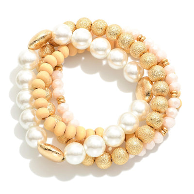 Set of Four Mixed Media Stretch Bracelets Featuring Pearl, Wood, and Textured Metal Tone Beads