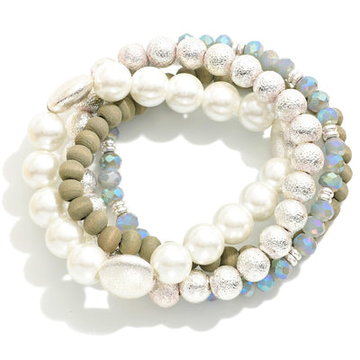 Set of Four Mixed Media Stretch Bracelets Featuring Pearl, Wood, and Textured Metal Tone Beads