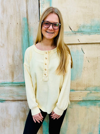 SC BUTTER YELLOW RIBBED HENLEY LONG SLEEVE EXPOSED SEAM KNIT TOP