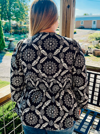Black Printed V-Neck Blouse with a Zipper Front and Smocked Waist