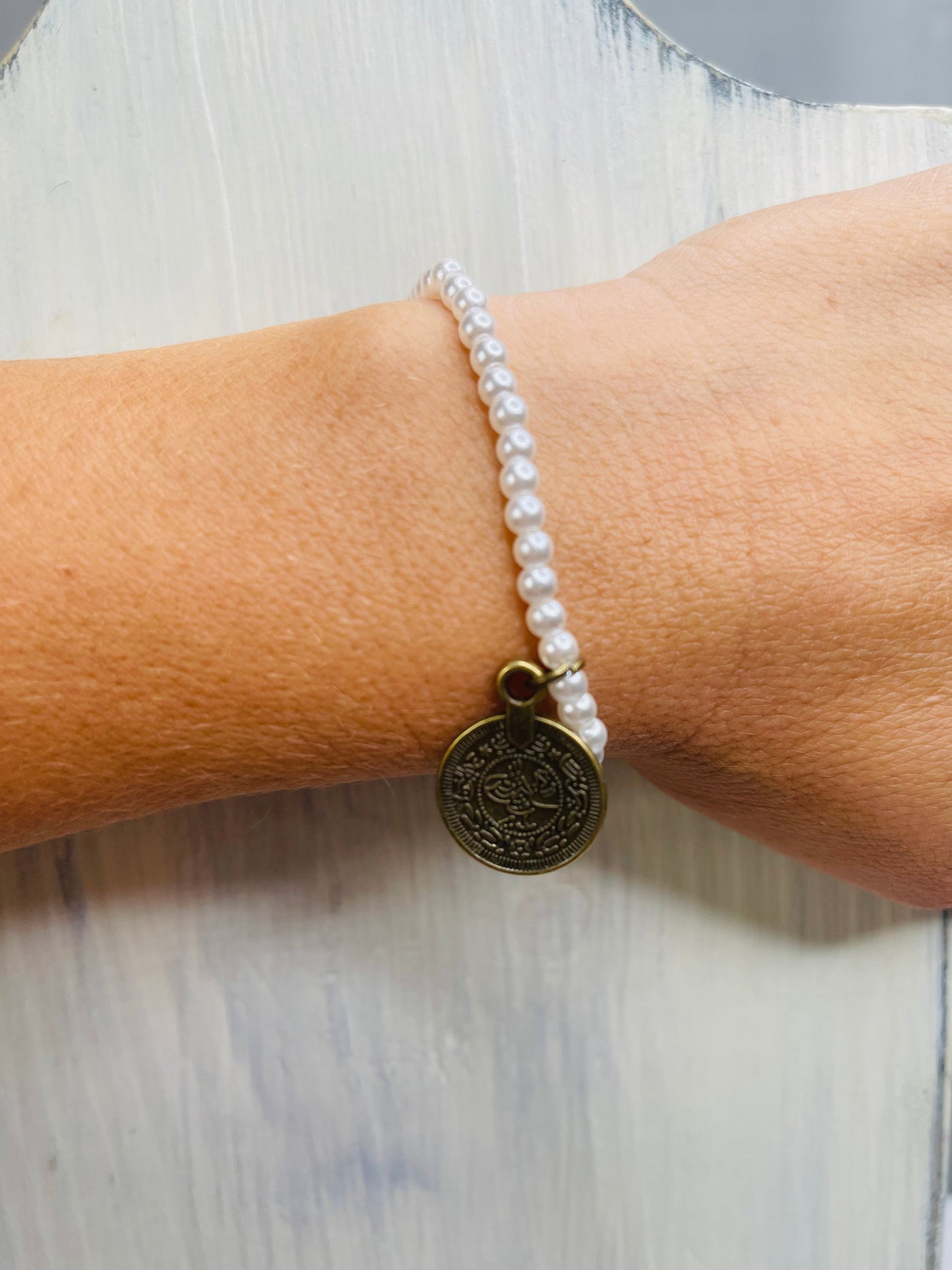Pearl Bracelet with Bronze Coin