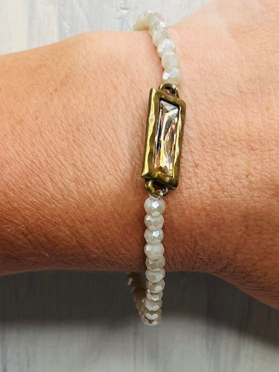 Cream Beaded Bracelet with Brass Crystal Pendant